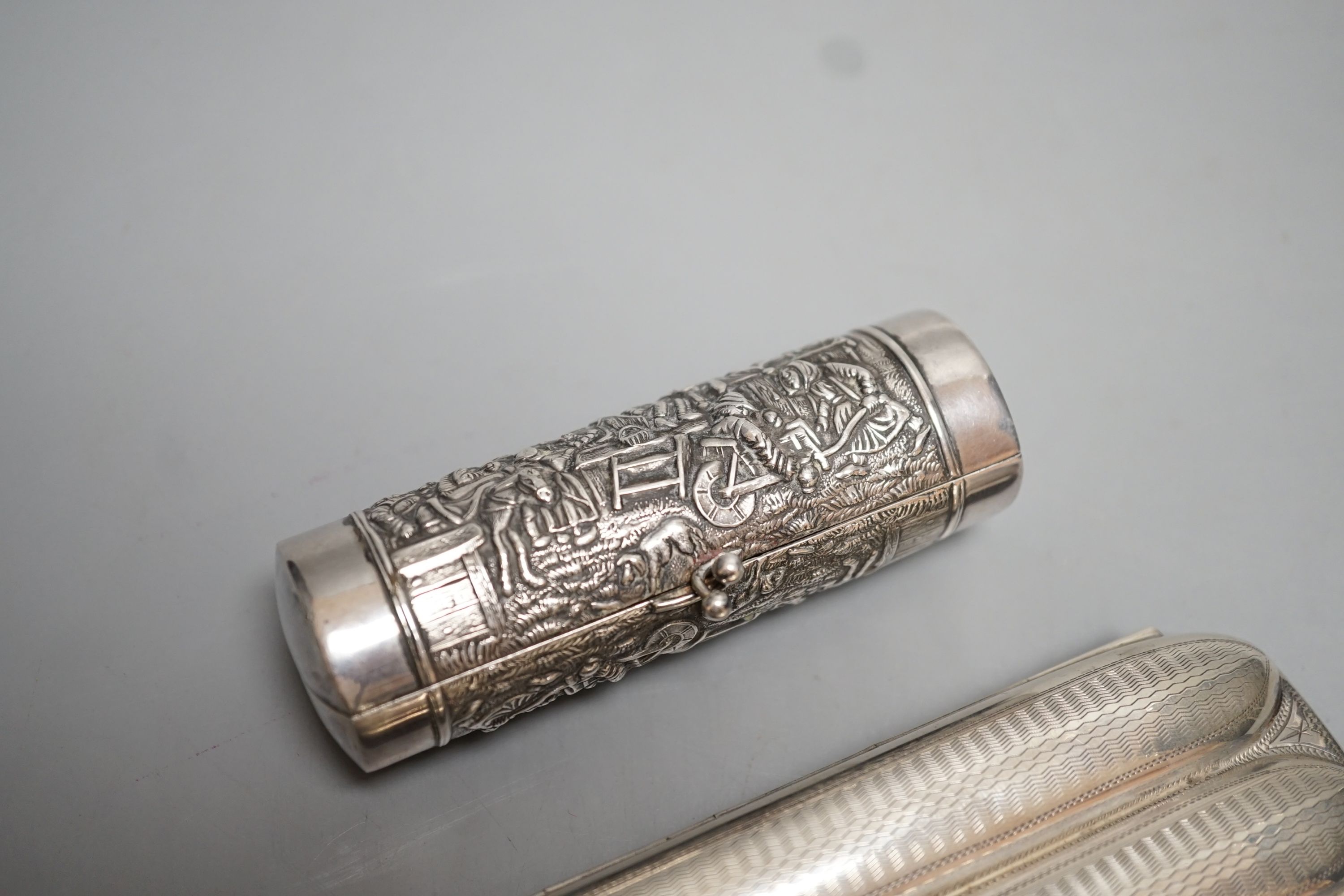 A George V silver three division cigar case, Birmingham, 1915, 13.1cm and a white metal cylindrical purse.